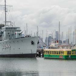 HMAS Castlemaine and tram boat